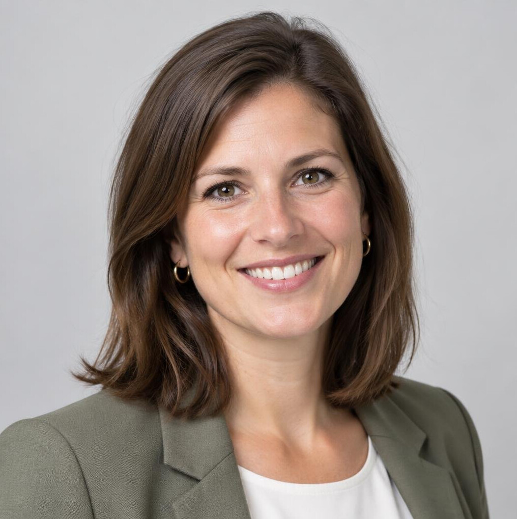 Studio portrait of a smiling Belgian businesswoman in business casual clothing